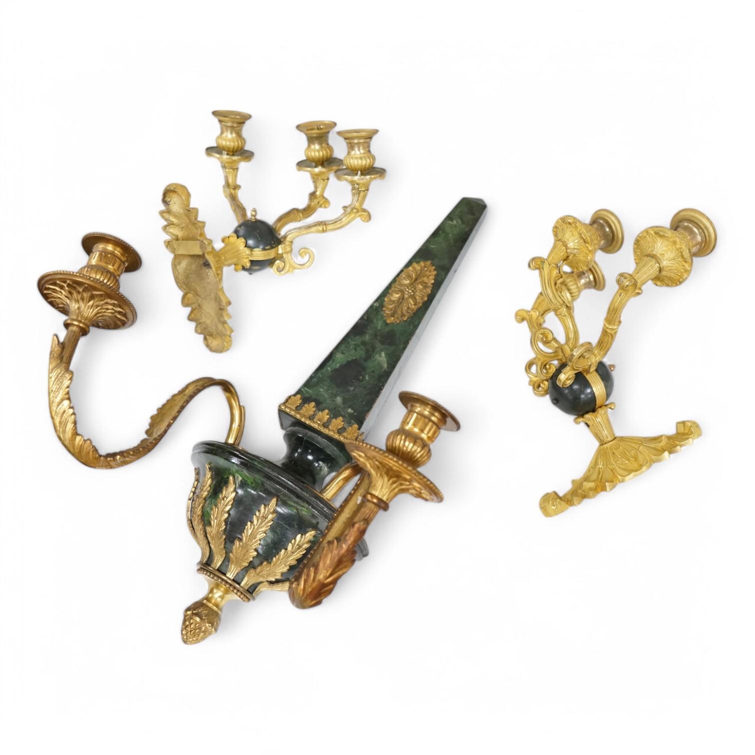 A simulated malachite wall sconce and a pair of ormolu three-branch wall lights, 55cm high. Condition - fair/good